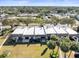 Aerial view of condo building, showcasing flat roofs and landscaping at 8755 Bardmoor Blvd # 105, Seminole, FL 33777