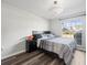 Comfortable bedroom with a double bed and large window at 8755 Bardmoor Blvd # 105, Seminole, FL 33777