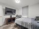 Bedroom with a large TV and a double bed at 8755 Bardmoor Blvd # 105, Seminole, FL 33777