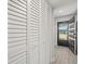 White louvered closet doors in entryway at 8755 Bardmoor Blvd # 105, Seminole, FL 33777