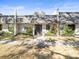 Front view of condo building, showing landscaping and building exterior at 8755 Bardmoor Blvd # 105, Seminole, FL 33777