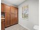 Well-equipped kitchen featuring ample wood cabinets and tile flooring at 8755 Bardmoor Blvd # 105, Seminole, FL 33777