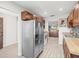 Bright kitchen showcasing stainless steel appliances and wood cabinets at 8755 Bardmoor Blvd # 105, Seminole, FL 33777