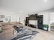 Living room showcasing a sectional sofa and entertainment center at 8755 Bardmoor Blvd # 105, Seminole, FL 33777