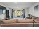 Living room with sectional sofa and sliding glass doors to patio at 8755 Bardmoor Blvd # 105, Seminole, FL 33777