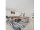 Open living area with sectional sofa and large area rug at 8755 Bardmoor Blvd # 105, Seminole, FL 33777