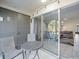 Patio with table and chairs and view into the living room at 8755 Bardmoor Blvd # 105, Seminole, FL 33777