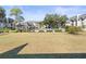 Community pool and grassy courtyard at 8755 Bardmoor Blvd # 105, Seminole, FL 33777
