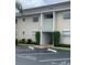 Condo building exterior with parking and awning at 8814 Bay Pointe Dr # 204, Tampa, FL 33615