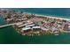 Aerial view of a condo building near the beach and water at 9815 Harrell Ave # 302, Treasure Island, FL 33706