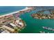 Wide aerial view of waterfront property and beach at 9815 Harrell Ave # 302, Treasure Island, FL 33706