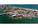 Aerial view of waterfront property with community pool and boat slips at 9815 Harrell Ave # 302, Treasure Island, FL 33706