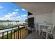 Balcony with table and chairs, offering waterfront views at 9815 Harrell Ave # 302, Treasure Island, FL 33706