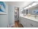 Double vanity bathroom with updated fixtures at 9815 Harrell Ave # 302, Treasure Island, FL 33706