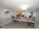 Large dining table with seating for six, adjacent to kitchen at 9815 Harrell Ave # 302, Treasure Island, FL 33706