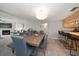 Open dining area with kitchen access and modern lighting at 9815 Harrell Ave # 302, Treasure Island, FL 33706