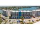 Exterior view of condo building and parking lot at 9815 Harrell Ave # 302, Treasure Island, FL 33706