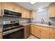 Well-equipped kitchen with stainless steel appliances at 9815 Harrell Ave # 302, Treasure Island, FL 33706