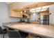 Kitchen with stainless steel appliances and breakfast bar at 9815 Harrell Ave # 302, Treasure Island, FL 33706