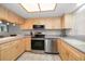Modern kitchen with stainless steel appliances at 9815 Harrell Ave # 302, Treasure Island, FL 33706