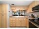 Updated kitchen boasts stainless steel appliances and ample cabinetry at 9815 Harrell Ave # 302, Treasure Island, FL 33706