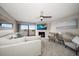 Bright living room with water views, fireplace, and comfy seating at 9815 Harrell Ave # 302, Treasure Island, FL 33706