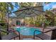 Enjoy this refreshing pool with patio seating and umbrellas at 1002 Hull S St, Gulfport, FL 33707