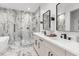 Elegant bathroom with double vanity, marble flooring, and large mirrors at 102 W Adalee St # 3, Tampa, FL 33603