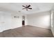 Main bedroom with ceiling fan, and access to bathroom at 10521 Summer Azure Dr, Riverview, FL 33578