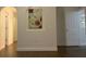 Bright hallway with hardwood floors and neutral walls at 10930 Banyan Wood Way, Riverview, FL 33579