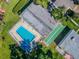 Community pool, shuffleboard courts, and lush landscaping at 11511 113Th St # 27C, Largo, FL 33778