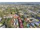 Aerial shot of a community showcasing houses, trees, and a nearby body of water at 11511 113Th St # 27C, Largo, FL 33778