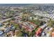 Aerial perspective of a community with homes, trees, and a road nearby at 11511 113Th St # 27C, Largo, FL 33778