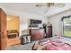 A bedroom featuring carpeted floors, a ceiling fan, and a view into an adjacent room at 11511 113Th St # 27C, Largo, FL 33778