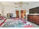 Cozy bedroom with a ceiling fan, carpeted floors and wooden dresser at 11511 113Th St # 27C, Largo, FL 33778