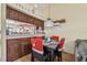 Dining area with a table, chairs, and view into the kitchen at 11511 113Th St # 27C, Largo, FL 33778
