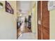 View of the home's entryway leading into the living room with wood flooring at 11511 113Th St # 27C, Largo, FL 33778