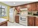Another view of the kitchen highlighting the window and appliances at 11511 113Th St # 27C, Largo, FL 33778