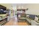 Living room with a couch, fireplace, and view to the kitchen at 11511 113Th St # 27C, Largo, FL 33778