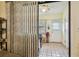 Small patio area with sliding vertical blinds and tiled floor at 11511 113Th St # 27C, Largo, FL 33778