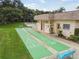 Outdoor shuffleboard courts next to community amenities at 11511 113Th St # 27C, Largo, FL 33778