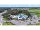 Aerial view of community clubhouse with pools, tennis courts and recreation areas at 13388 Great Plains Dr, Riverview, FL 33579