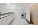 Bathroom featuring double vanities, granite counters and a bathtub with shower at 13388 Great Plains Dr, Riverview, FL 33579