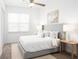 Bright bedroom with a comfortable bed, soft white linens, and natural light at 13388 Great Plains Dr, Riverview, FL 33579