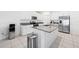 Updated kitchen with granite countertops, stainless steel appliances, and white cabinets at 13388 Great Plains Dr, Riverview, FL 33579