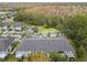 Aerial view of townhome roofs and a wooded area at 18183 Paradise Point Dr, Tampa, FL 33647