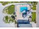 An aerial view of the community pool, spa, and surrounding patio at 18320 Gulf Blvd # 303, Redington Shores, FL 33708