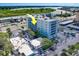 An aerial view of a condo building near the water, showing its surrounding area at 18320 Gulf Blvd # 303, Redington Shores, FL 33708