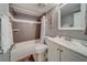 Bathroom with tub shower, white vanity, and toilet at 18320 Gulf Blvd # 303, Redington Shores, FL 33708