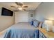 King size bed and ceiling fan in this bedroom at 18320 Gulf Blvd # 303, Redington Shores, FL 33708